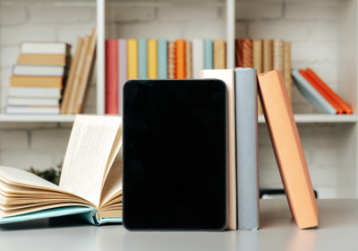 Tablet With Stacked Books